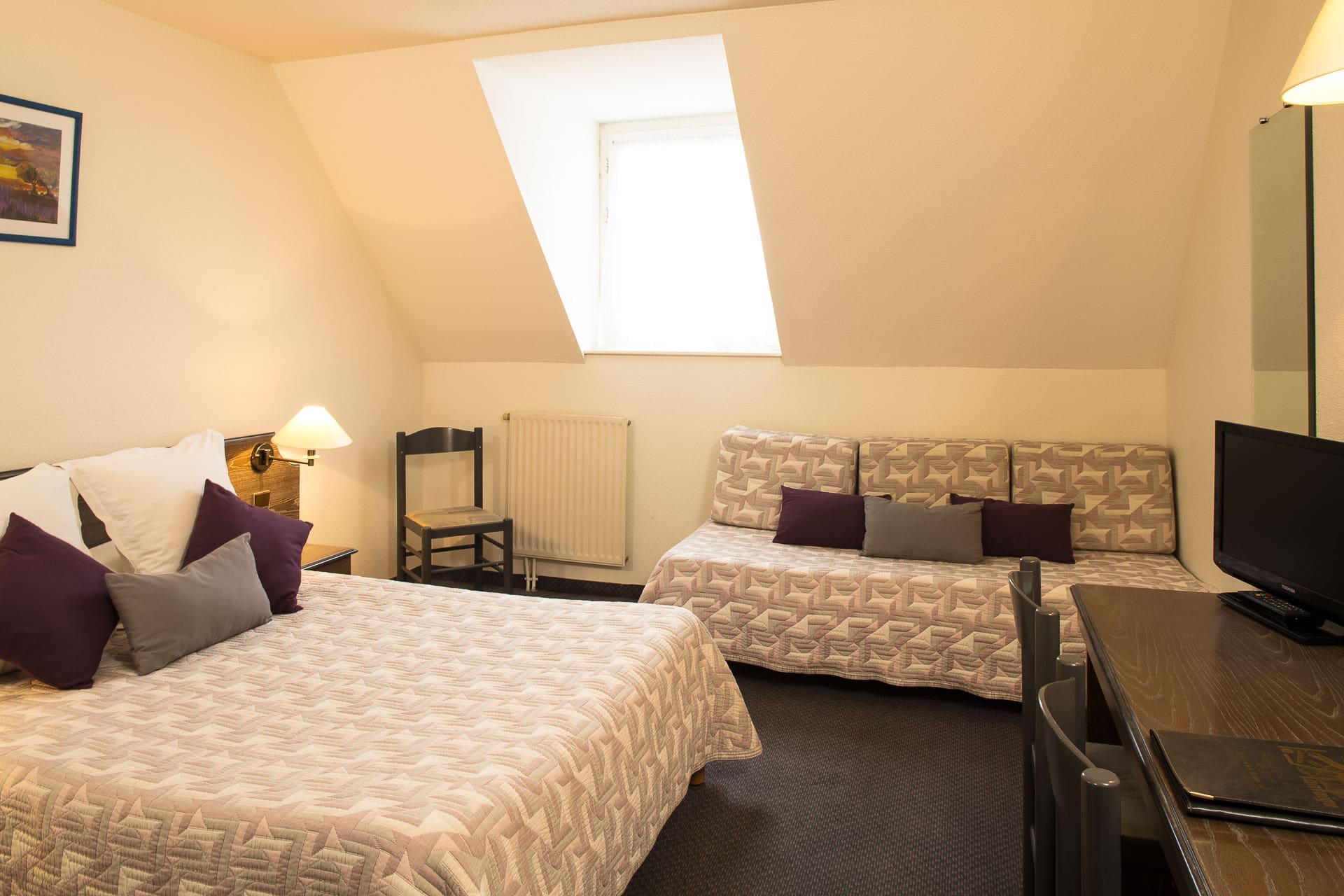 Chambre triple standard spacieuse avec trois lits